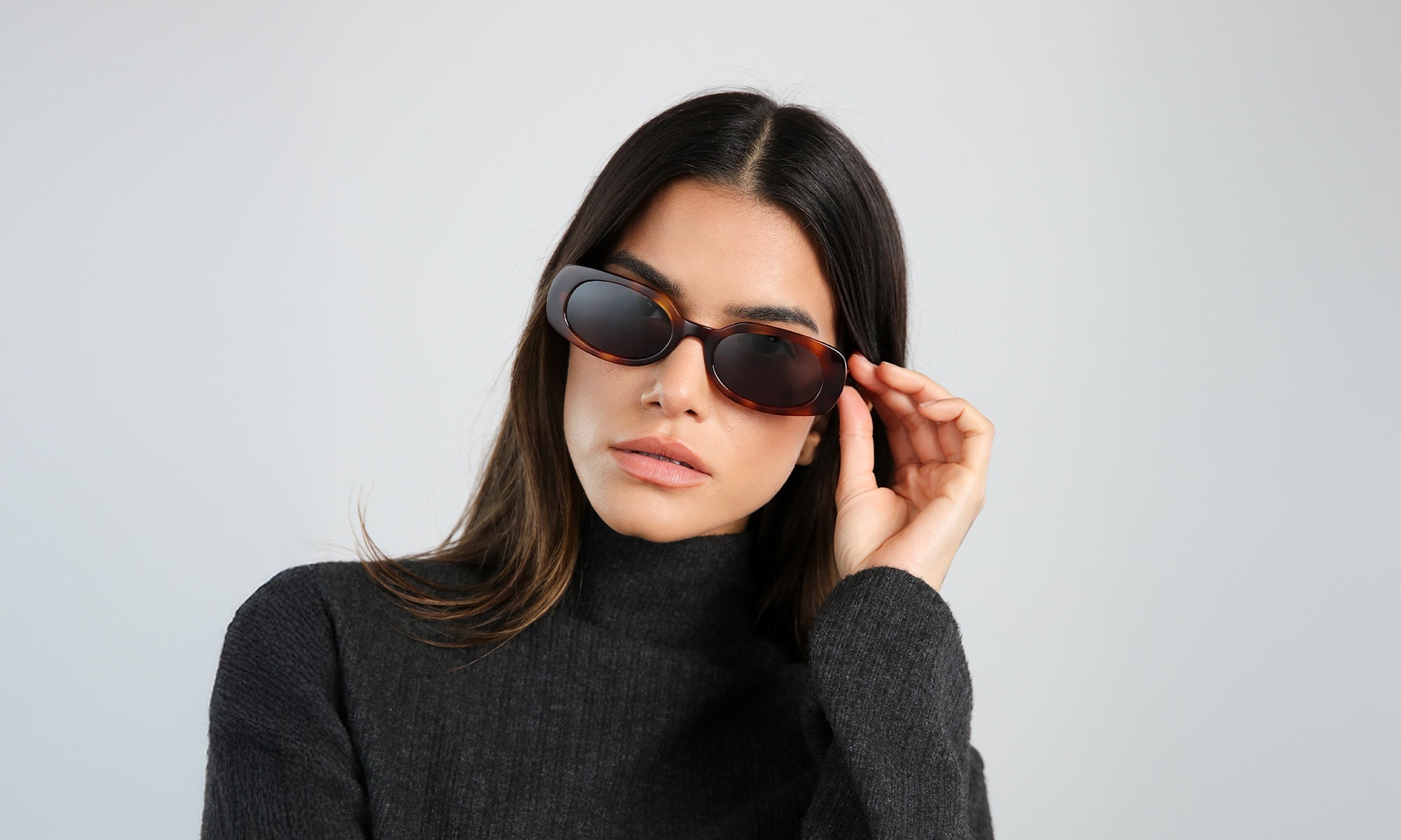 Model wearing a dark gray turtleneck and the new Shirley 51 Sunglasses