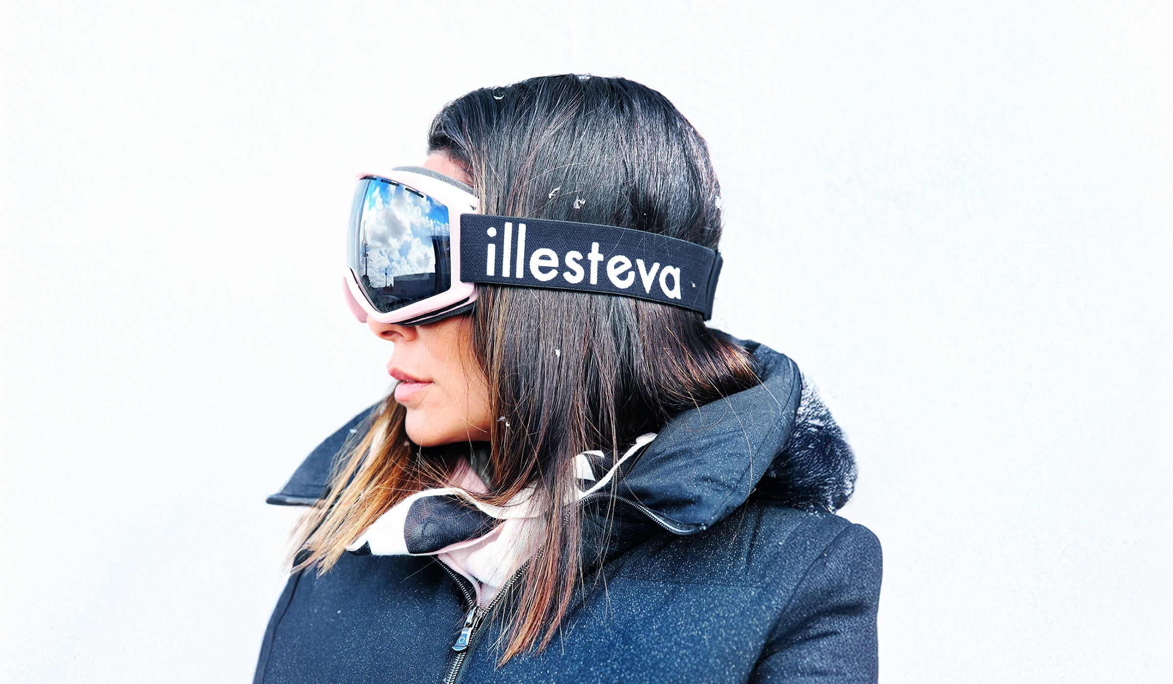 Model wearing illesteva Ski Goggles and a puffer jacket