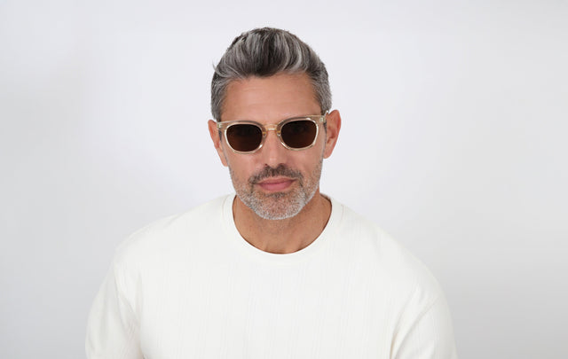 Model with salt and pepper hair and beard wearing Veneto Sunglasses in Champagne with Brown