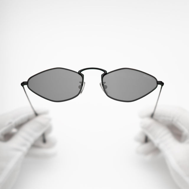 Gloves holding Austria Sunglasses Matte Black with Grey Flat