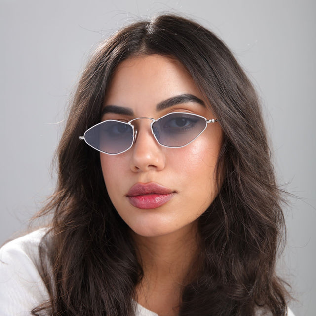 Brunette woman looking left wearing Austria Sunglasses Silver with Midnight Blue Flat Gradient