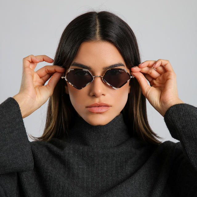 Brunette model in a heather grey cashmere turtleneck wearing Beak Ace 53 Sunglasses White Tortoise/Gold with Grey Flat