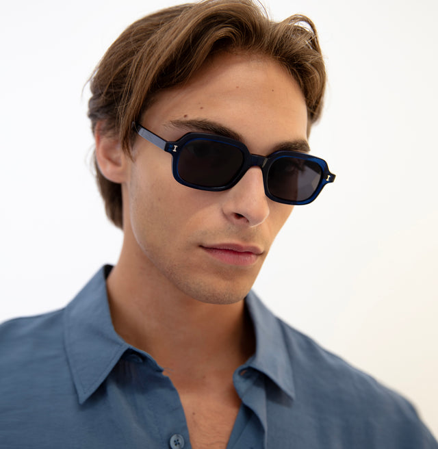 Model with straight brown hair wearing Berlin Sunglasses Navy with Grey
