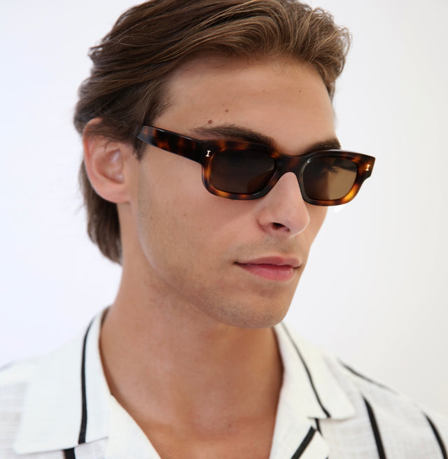 Side profile of man with light brown hair wearing Cali Sunglasses Havana with Brown