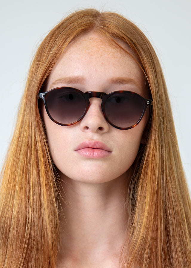 Model with straight red hair wearing Capri Sunglasses Havana with Grey Gradient