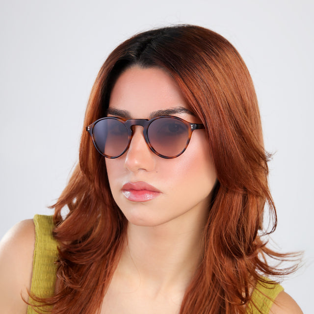 Another angle of woman with red hairlooking right wearing Capri Sunglasses Havana with Brown Gradient