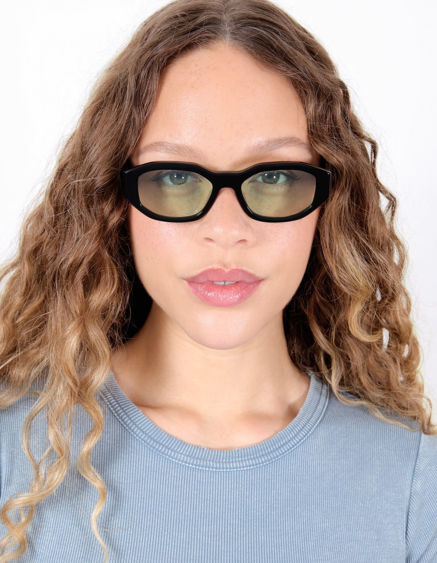 Model wearing Cassette Sunglasses in Black with Mint Flat See Through
