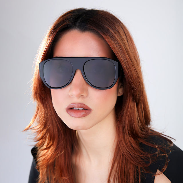 Woman with red hair wearing Colorado Sunglasses Black with Grey