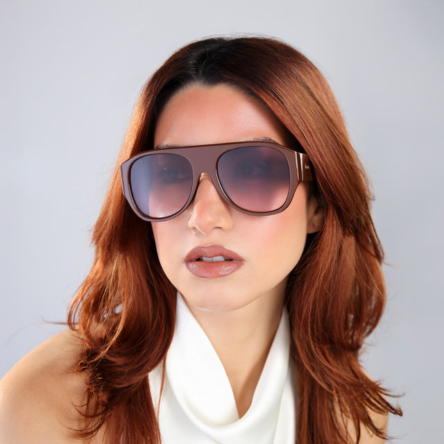 Woman with red hair in a white halter blouse wearing Colorado Sunglasses Espresso with Brown Gradient