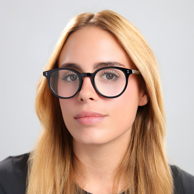 Blond woman in a black tee wearing Dakota Optical Black Optical