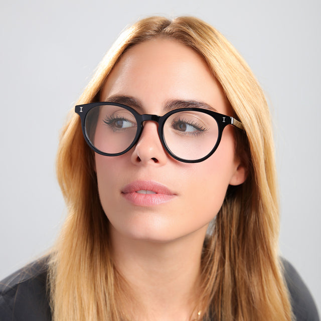 Another angle of blond woman in a black tee wearing Dakota Optical Black Optical