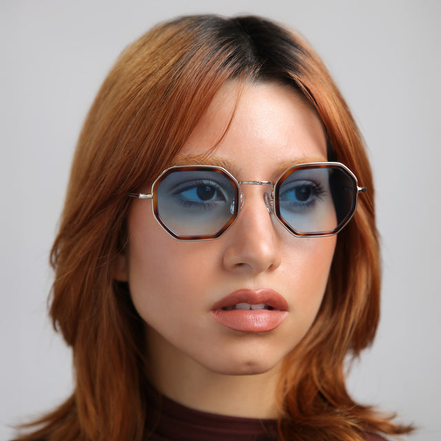 Another angle of model with red hair wearing Dylan Tate Sunglasses Havana/Gold with Blue Flat Gradient See Through