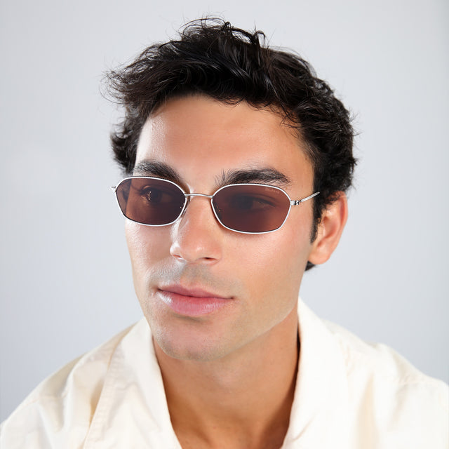 Another angle of man with brown hair in a pale yellow linen shirt wearing East Houston Sunglasses Silver with Brown Flat