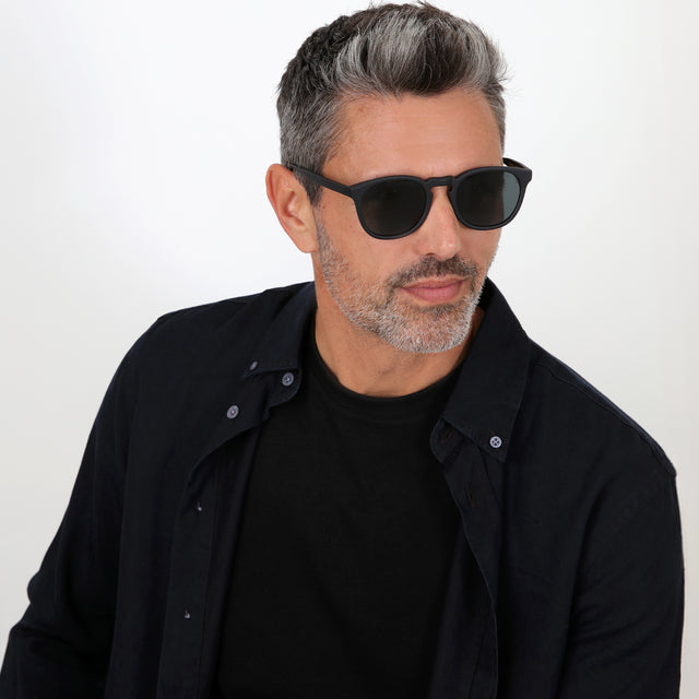 Model with salt and pepper hair and beard wearing Eldridge Sunglasses Matte Black with Grey Flat