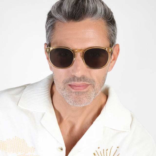 Model with salt and pepper hair and beard wearing Eldridge 56 Sunglasses Citrine with Grey Flat