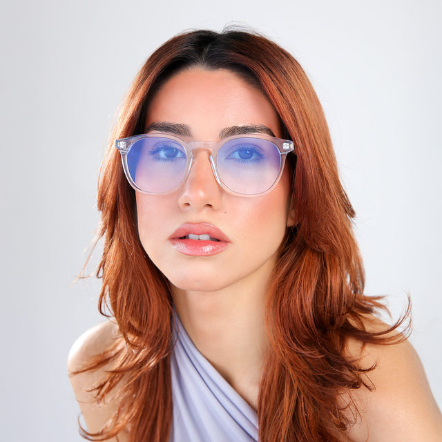 Another angle of woman with red hair wearing Eldridge Sunglasses Clear with Blue Flat Gradient See Through