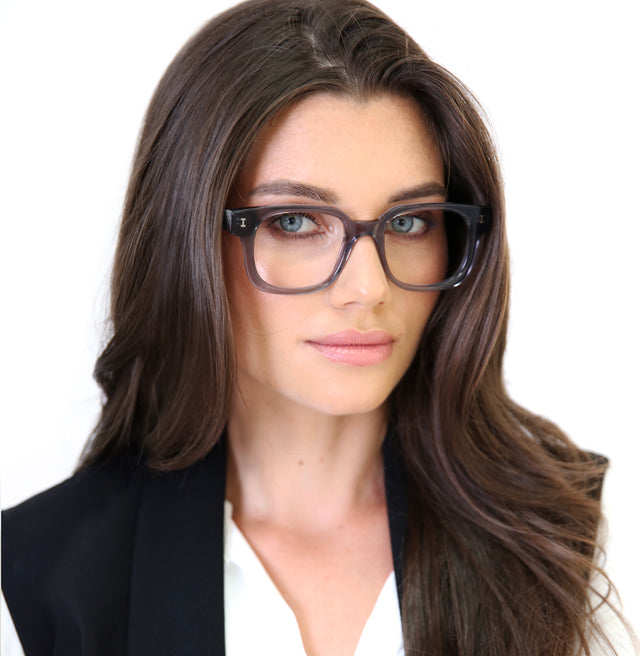 Brunette model with straight hair wearing Ellison Optical Mercury Optical