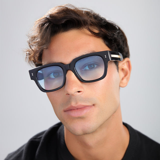 Close up of man in a black shirt wearing Francesco Sunglasses Black/Gold with Blue Gradient See Through