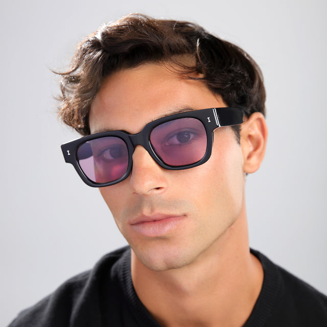 Close up of man in a black shirt wearing Francesco Sunglasses Black with Plum See Through