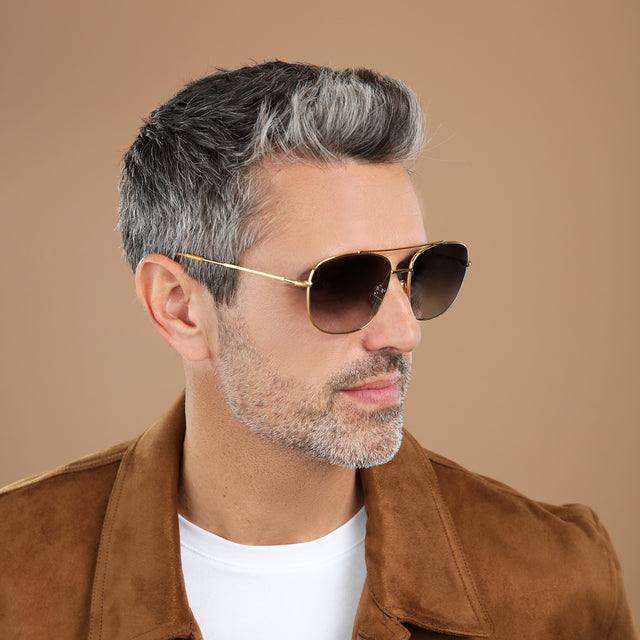 Man with salt and pepper hair and beard looking right wearing Frankie Sunglasses Gold with Grey Flat Gradient