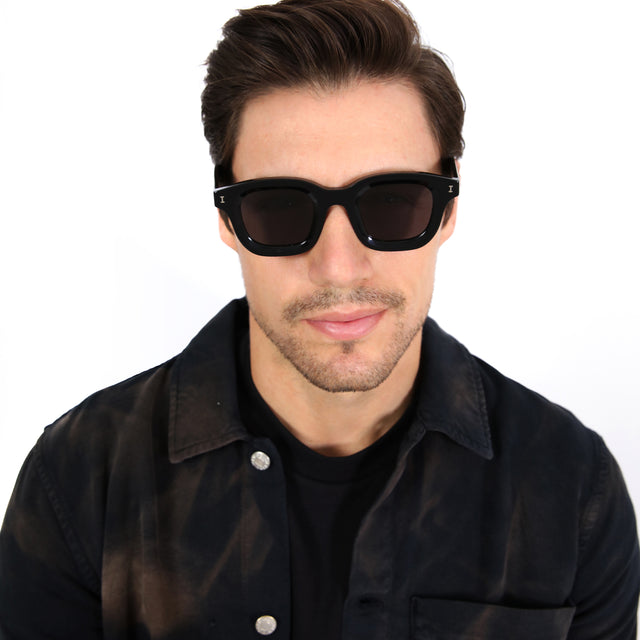 Model with short brown hair wearing George Sunglasses Black with Grey Flat