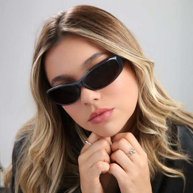 Woman with highlights in a leather jacket wearing Granada Sunglasses Graphite
