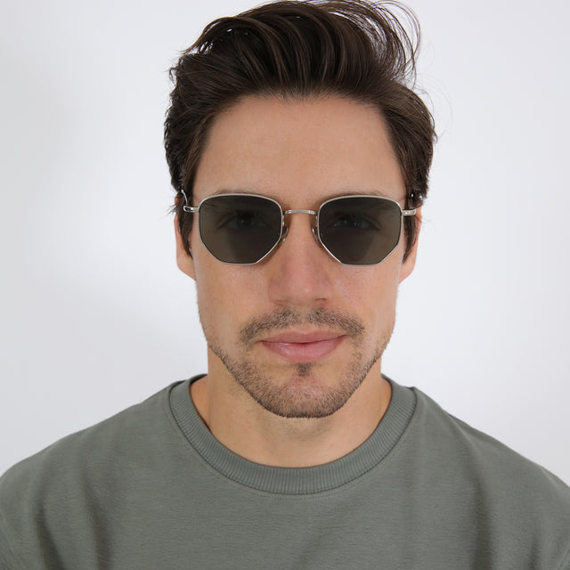 Model with short brown hair wearing Hunter Sunglasses Silver with Olive