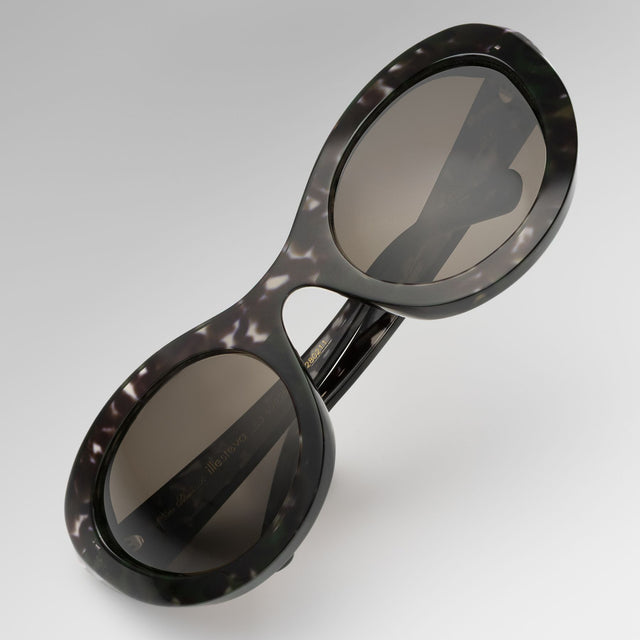 Kim Shui Sunglasses tilted at a diagonal Charcoal with Grey