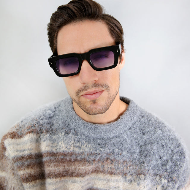 Model with short brown hair wearing Lewis 50 Sunglasses Black with Purple Flat Gradient