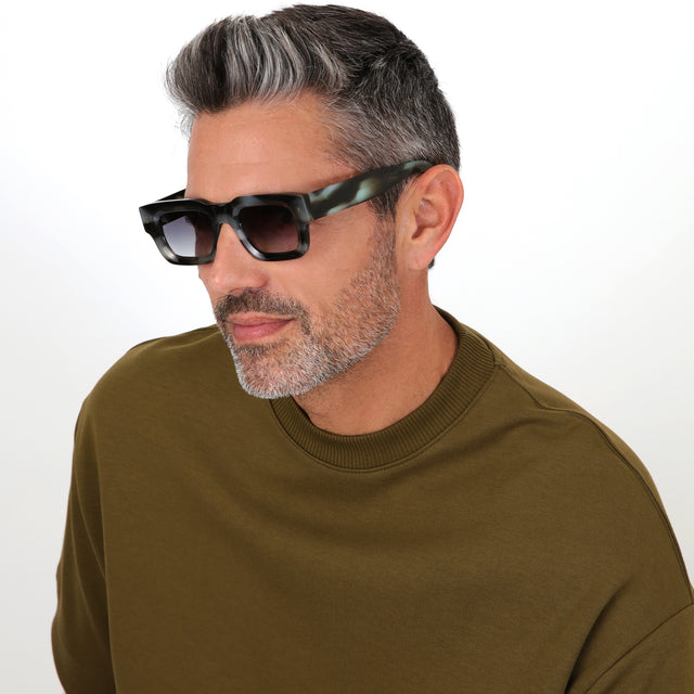 Model with salt and pepper hair and beard wearing Lewis Sunglasses Black Jade with Grey Flat Gradient