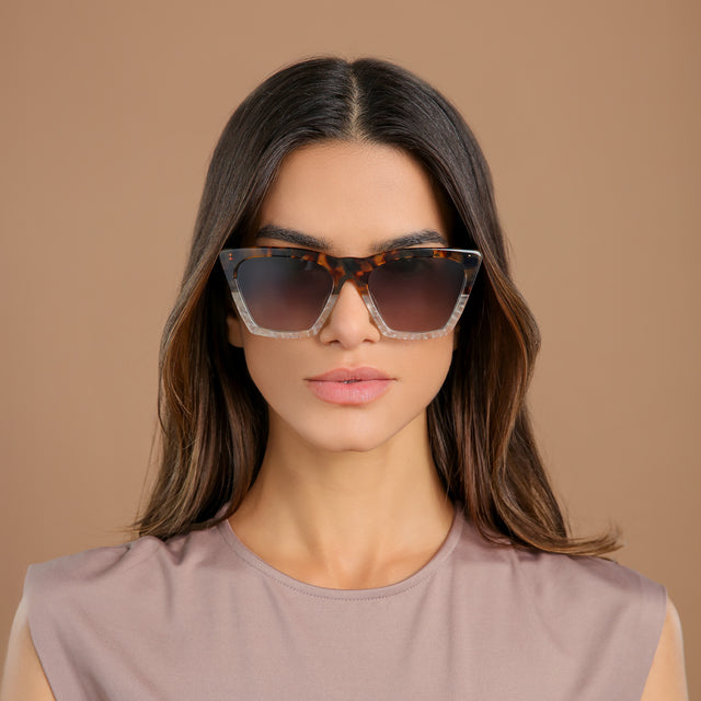 Brunette woman in a clay blouse wearing Lisbon Sunglasses H/H Maple Bone with Grey Gradient
