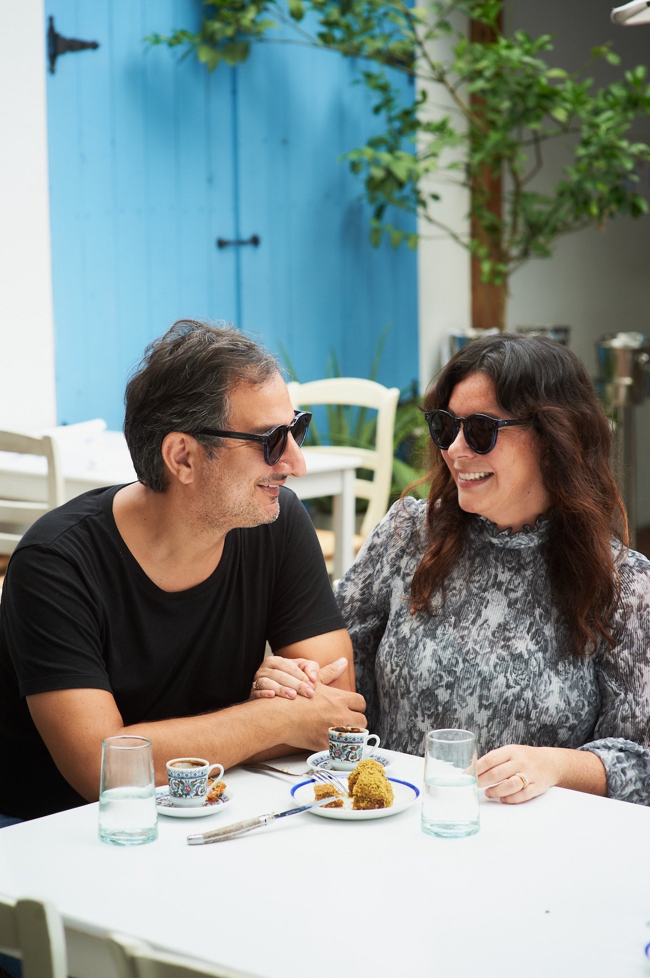 Couple wearing the Mandolin collaboration frames eating brunch