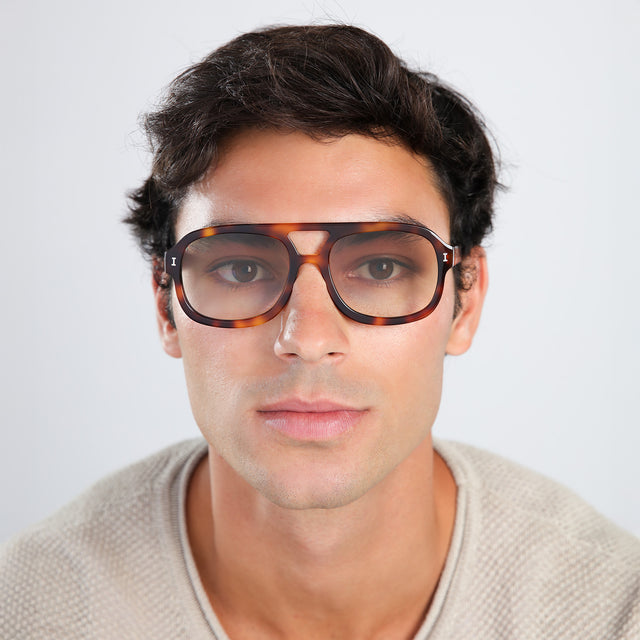 Man in a waffled sweatshirt wearing Memphis Sunglasses Havana with Taupe Gradient