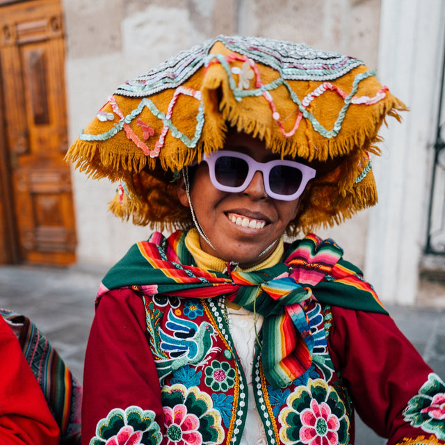 Young Peruvian woman in traditional Peruvian headdress wearing George Sunglasses in Matte Lilac