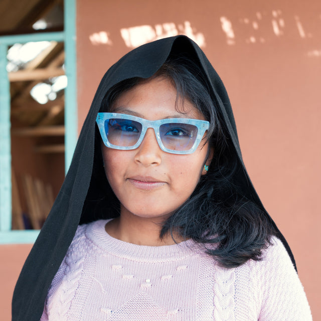 Young Peruvian girl wearing Portugal Sunglasses in Celeste