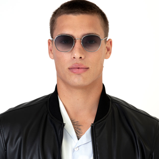 Model with buzzcut hairstyle wearing Prince Sunglasses Gunmetal with Grey Flat Gradient