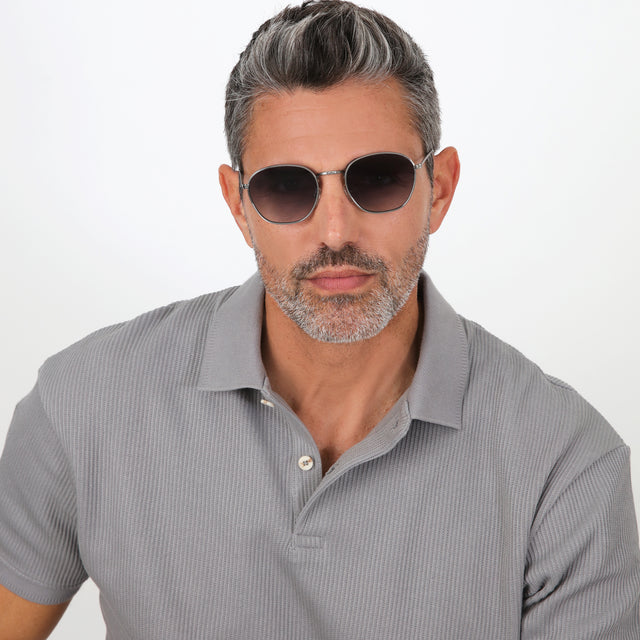 Model with salt and pepper hair and beard wearing Prince Sunglasses Gunmetal with Grey Flat Gradient