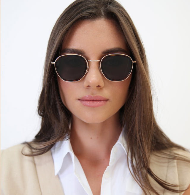 Brunette model with straight hair wearing Prince Tate Sunglasses Havana/Gold with Grey Flat