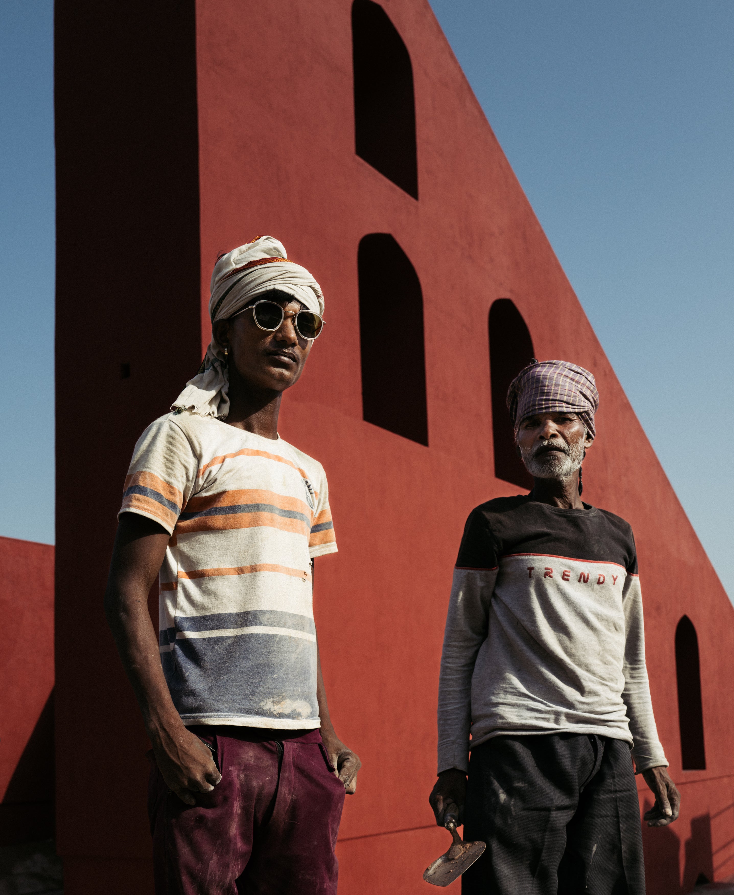 Man wearing Prince Tate Matte Clear Gold alongside another man in front of a geometric wall