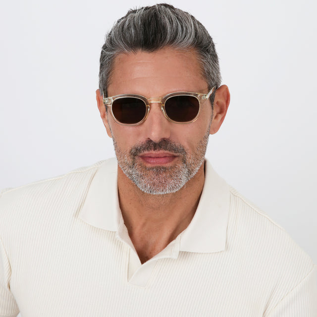 Model with salt and pepper hair and beard wearing Slope Sunglasses Champagne with Brown