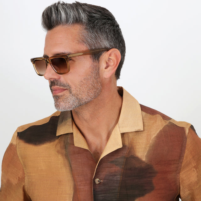 Model with salt and pepper hair and beard wearing Toscana Sunglasses Brown with Brown Gradient