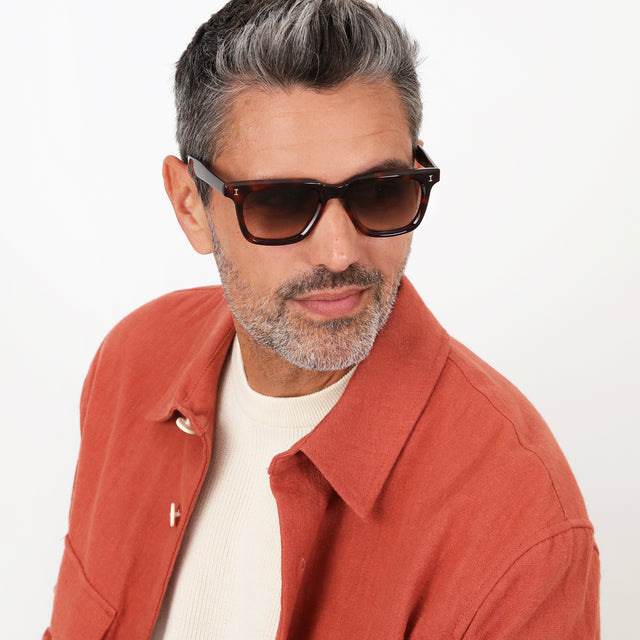 Model with salt and pepper hair and beard wearing Toscana Sunglasses Havana with Brown Gradient