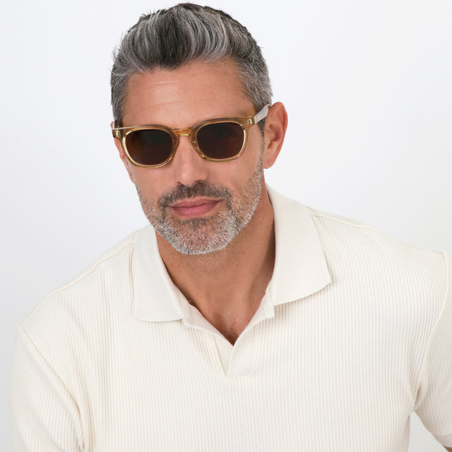 Model with salt and pepper hair and beard wearing Veneto Sunglasses Citrine with Brown Flat