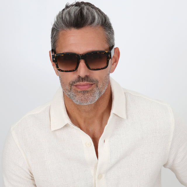 Model with salt and pepper hair and beard wearing Vito Sunglasses Flame with Brown Gradient