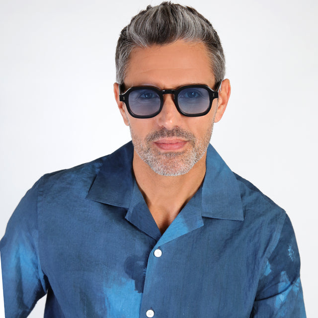 Model with salt and pepper hair and beard wearing Washington Sunglasses Black with Blue Flat Gradient See Through