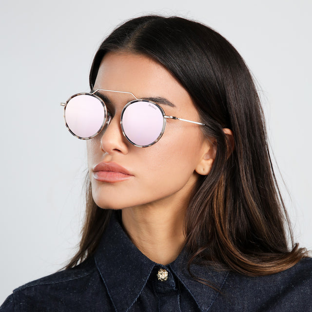Brunette model in a denim blouse looking right wearing Wynwood Ace Sunglasses White Tortoise/Gold with Bright Rose Flat Mirror