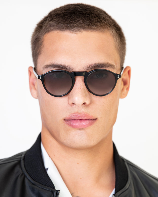 Model with buzzcut wearing Capri Sunglasses Black with Olive Gradient