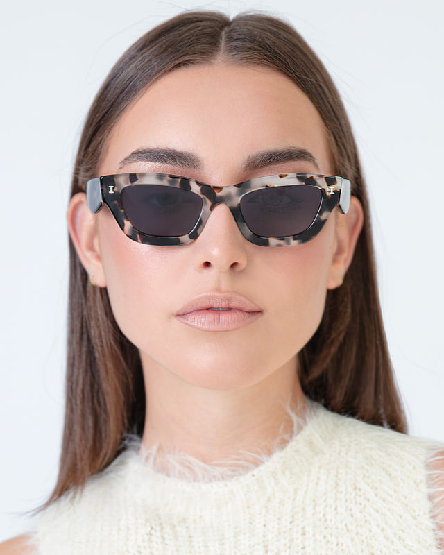 Brunette model with straight hair wearing Donna Sunglasses White Tortoise with Grey