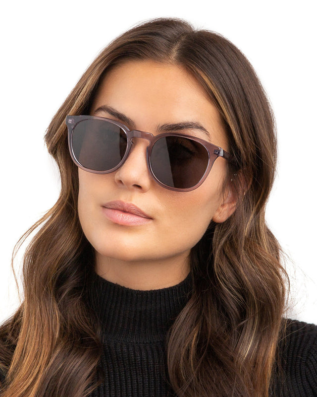 Brunette model with wavy hair wearing Eldridge 56 Sunglasses Mercury with Grey Flat