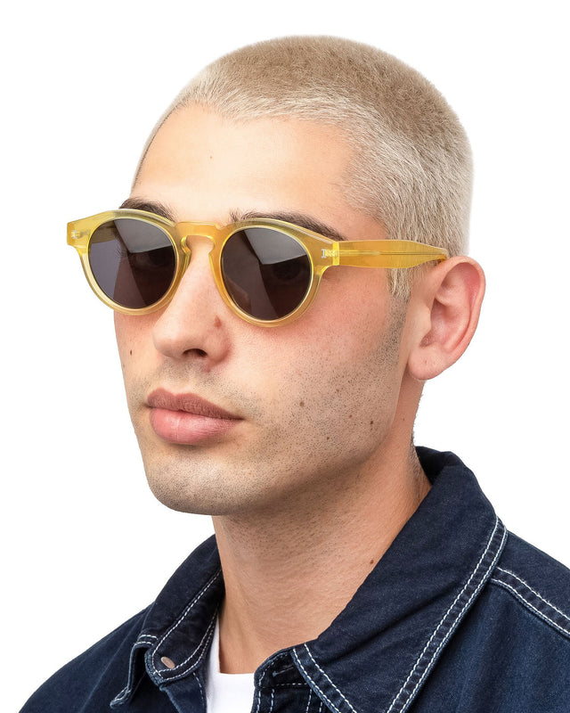 Model with blonde buzzcut wearing Leonard Sunglasses Blond with Grey